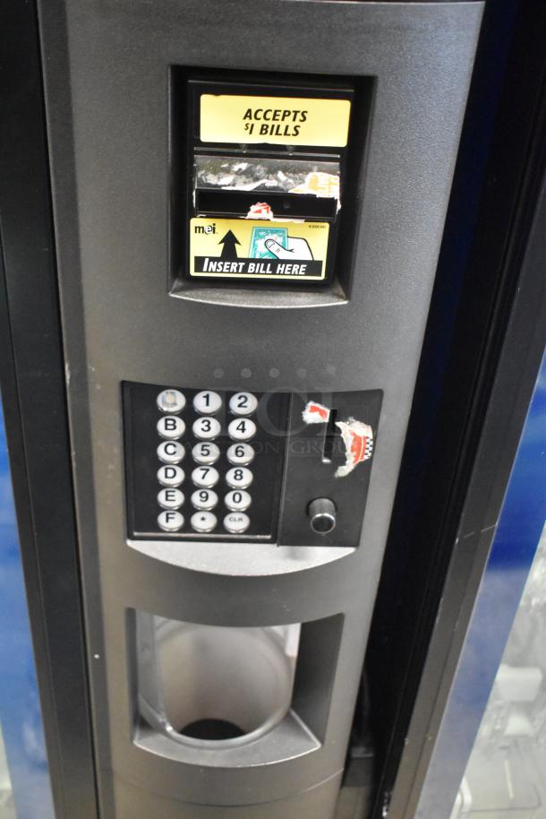 Crane 5800-4 metal commercial drink vending machine with bill acceptor, keypad, and coin slot. 115 volts, 1 phase.