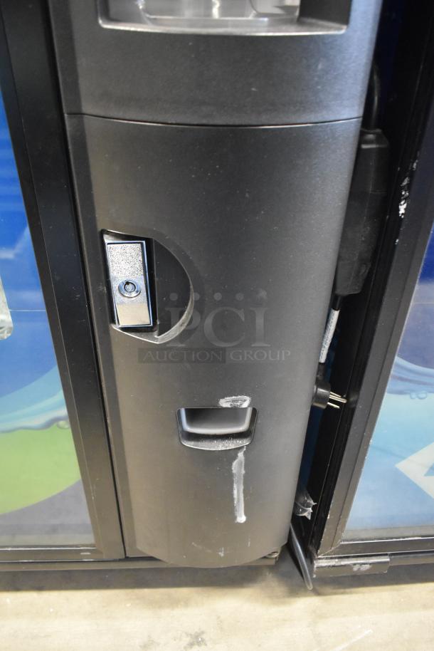 Crane 5800-4 metal vending machine, features bill acceptor, visible lock, used condition, 115V, 1 Phase.