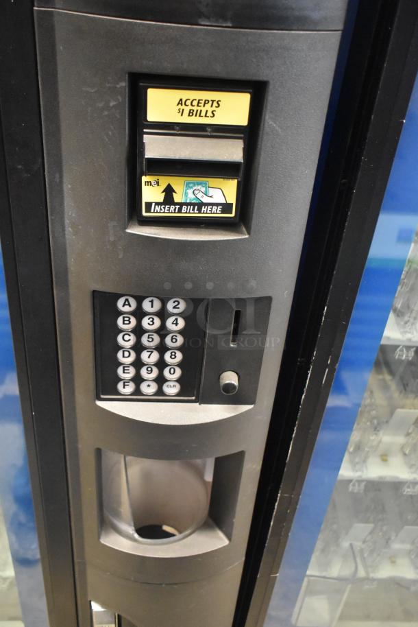 Crane 5800-4 metal drink vending machine with bill acceptor. Features keypad, accepts $1 bills, 115 volts, 1 phase.