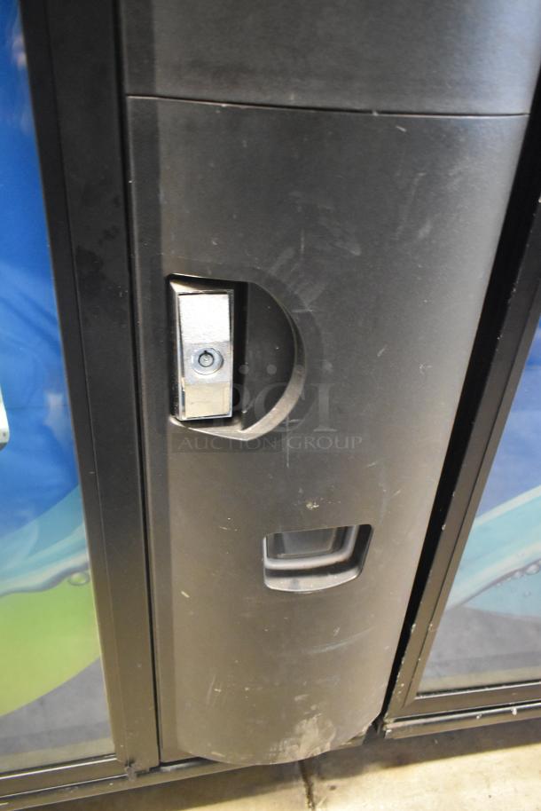 Crane 5800-4 metal beverage vending machine with bill acceptor, black finish, showing lock and handle. 115V, 1 phase.