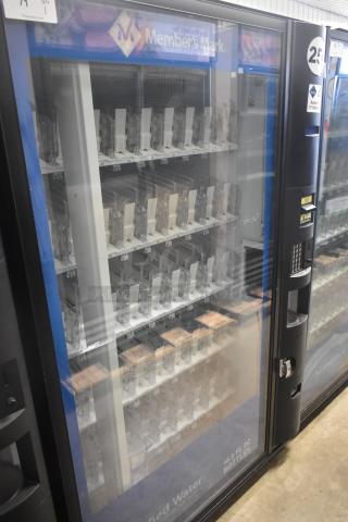 Crane 5800-4 metal commercial vending machine with bill acceptor, 115 volts, 1 phase, empty shelves, visible keypad.