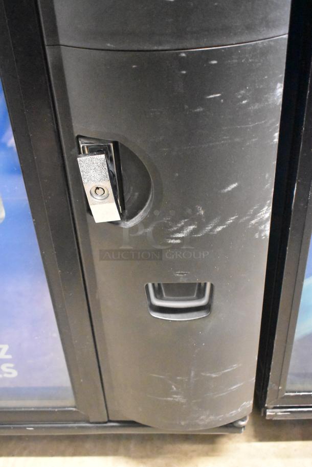 Crane 5800-4 metal vending machine, commercial grade, with bill acceptor. Visible wear; operates 115 volts, 1 phase.