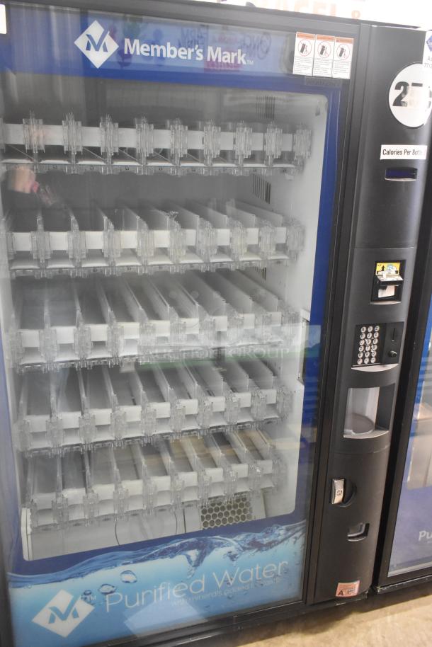 Crane 5800-4 metal commercial vending machine, accepts bills, 115 volts, 1 phase, displays Member's Mark branding.