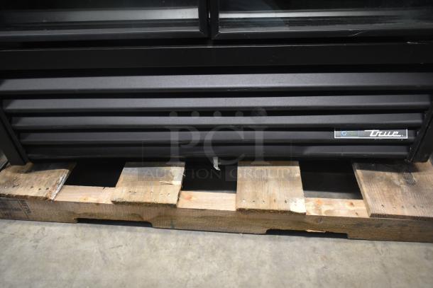 2021 True TVM-48SL-HC commercial 2 door cooler, 115V, 1 Phase, black exterior, on wooden pallet, True logo visible.