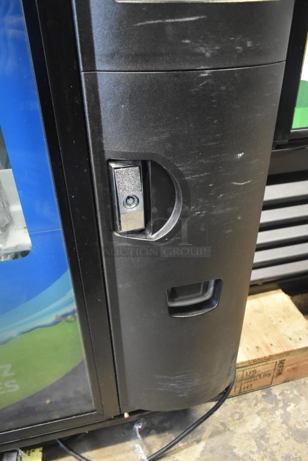 Crane 5800-4 vending machine, metal body, bill acceptor, 115V, 1 phase, showing handle and part of door. Used condition.