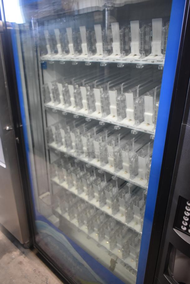 Crane 5800-4 Metal Vending Machine, glass front, bill acceptor, 115V, 1 Phase, excellent condition.