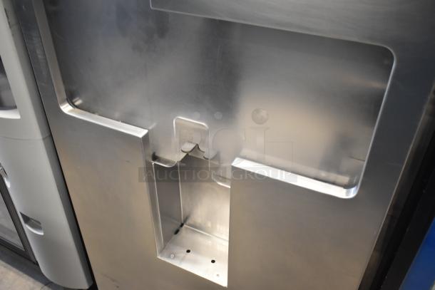 LATE MODEL JBT 2ND-GEN-MFJ-HE commercial citrus juicer, floor style, on casters, 115V, 1 phase, stainless steel exterior.