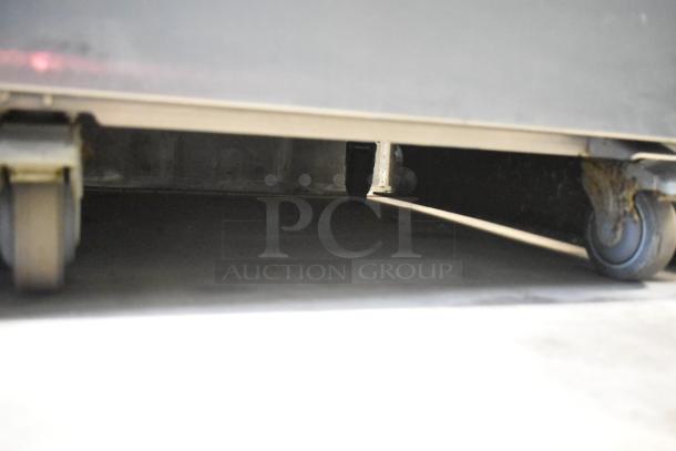 LATE MODEL JBT 2ND-GEN-MFJ-HE Fresh N Squeeze Citrus Juicer on commercial casters, 115V, 1 Phase.