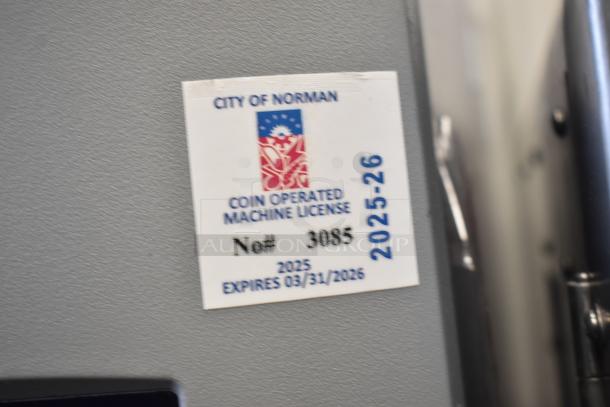 Crane 5800-4 metal drink vending machine, 115 volts, 1 phase, includes bill acceptor. City of Norman license expires 2026.