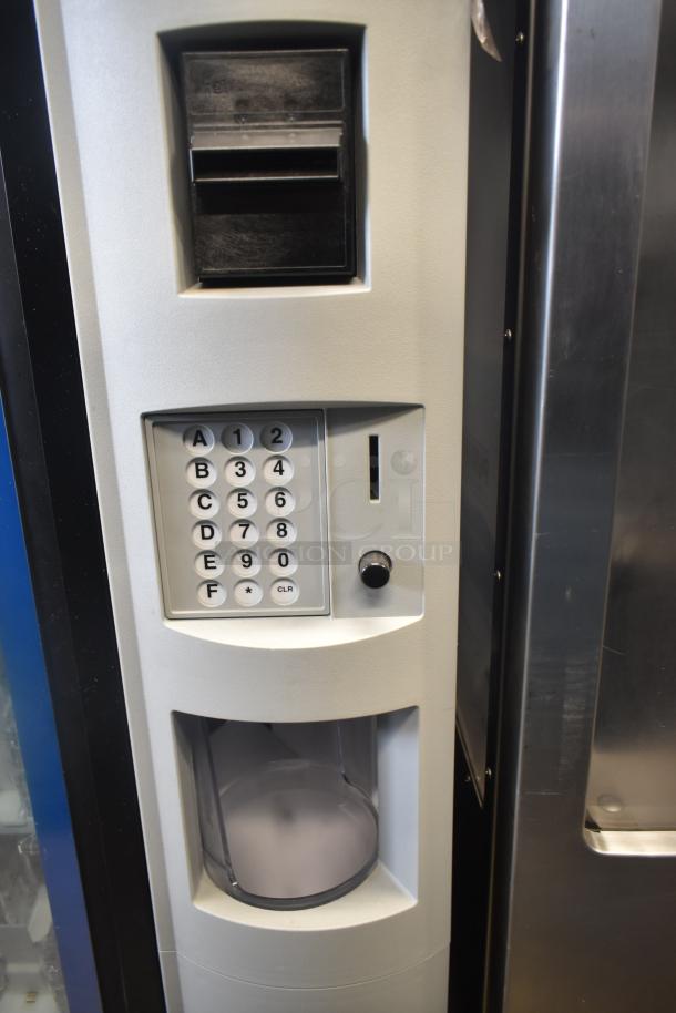 Crane 5800-4 vending machine with keypad, bill acceptor, bottle dispense area. 115 volts, 1 phase. Metal, commercial use.