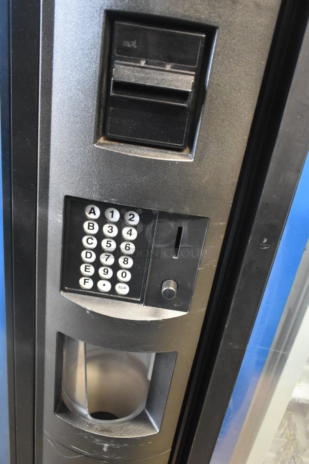 Crane 5800-4 metal vending machine with keypad, bill acceptor; 115V, 1 Phase, commercial grade, good condition.