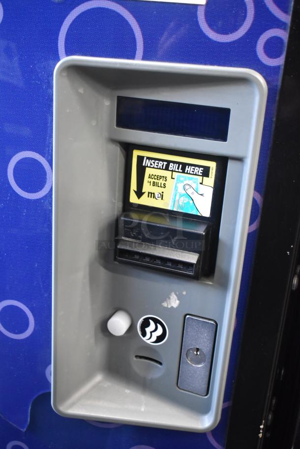 Metal commercial vending machine with bill acceptor, 115 volts, 1 phase. Features "Insert Bill Here" label.