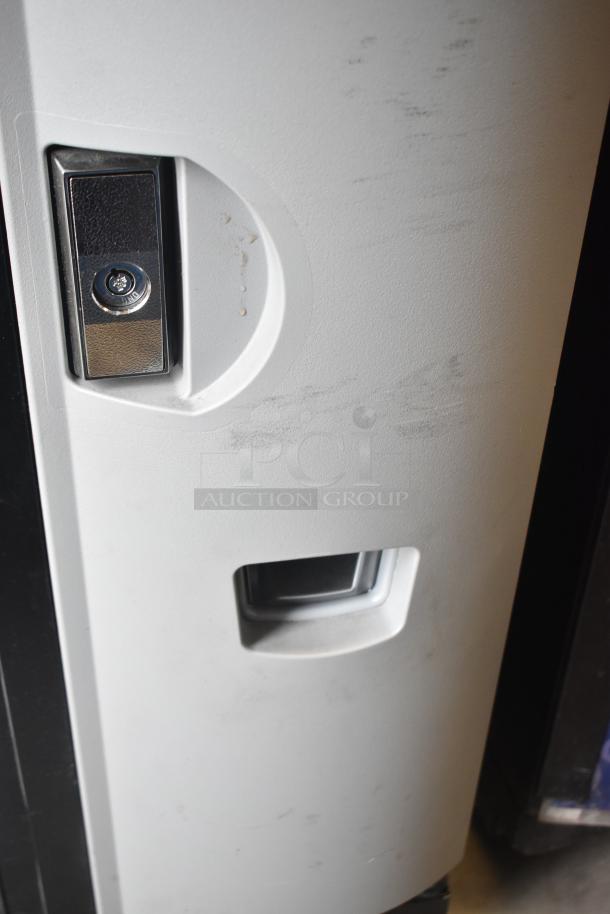 Crane 5800-4 metal vending machine, bill acceptor, 115V, 1 Phase, shows door lock, minor wear visible.