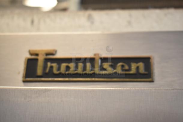 Traulsen G30013 commercial cooler, 3-door, stainless steel, 115 volts, 1 phase, Traulsen logo visible.