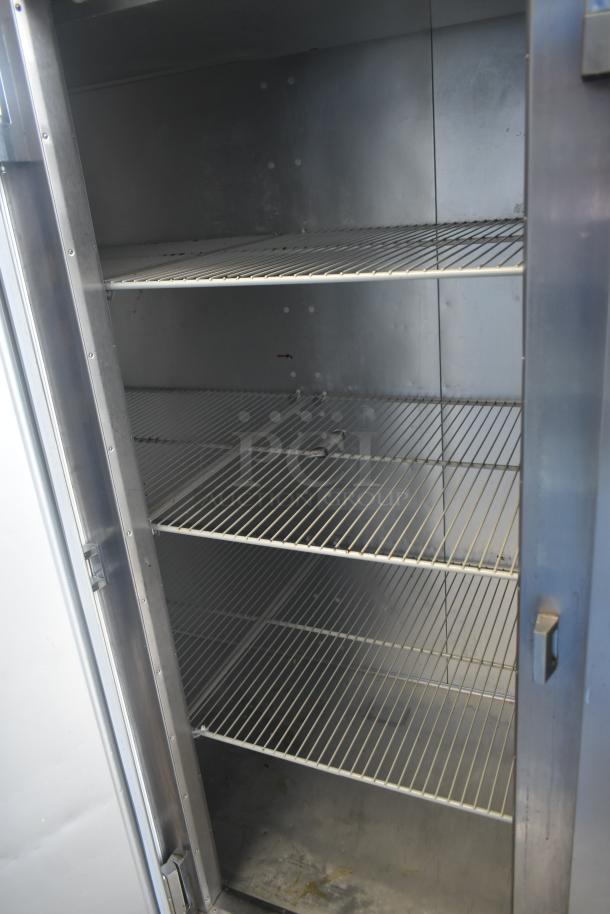 Traulsen G30013 commercial 3 door reach-in cooler, 115 volts, features wide shelving and robust stainless steel construction.