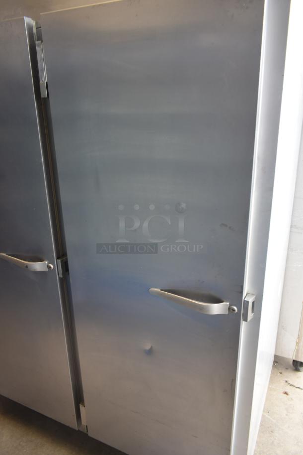 Traulsen G30013 Commercial 3 Door Reach In Cooler, stainless steel, slight dent on door, 115V, 1 Phase.