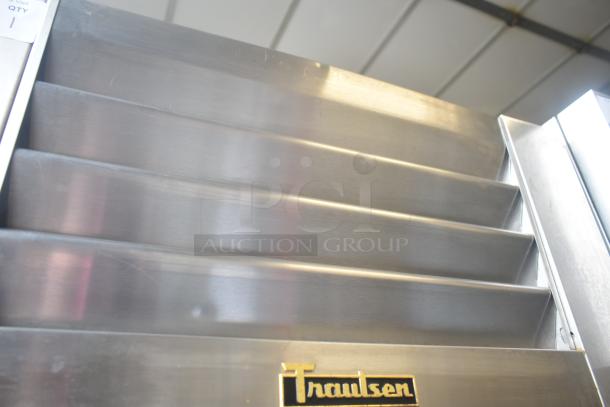 Traulsen ALT132WUT-FHS commercial freezer, single door, on casters, stainless steel, 115 volts, visible brand logo.