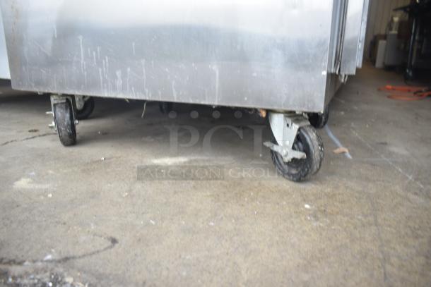 Traulsen ALT132WUT-FHS commercial freezer, single door, on casters, 115 volts, 1 phase, visible wear on exterior.