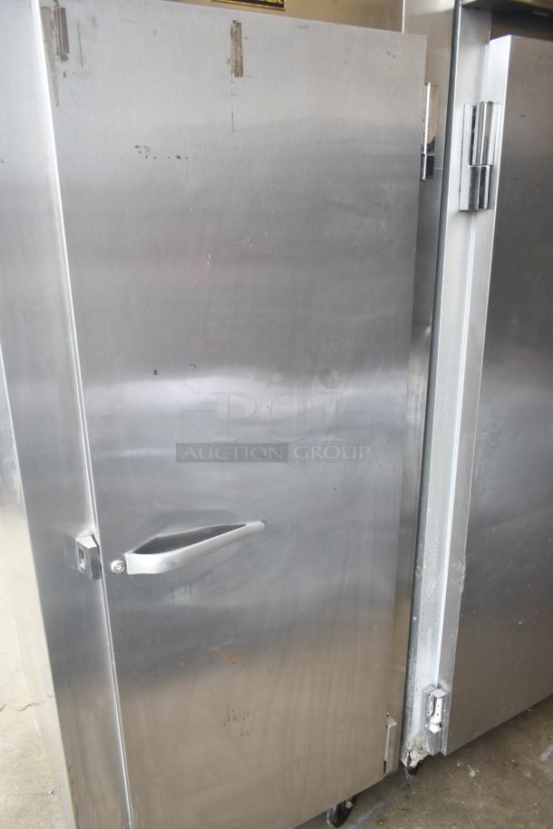 Traulsen ALT132WUT-FHS commercial freezer, single door, stainless steel, on casters. Some surface wear visible. 115V, 1-phase.