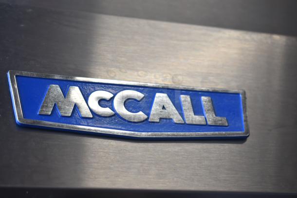 McCall 4-4070 commercial 3-door reach-in cooler badge, silver and blue, model 4-4070, 115 volts, 1 phase.