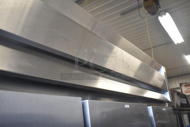 McCall 4-4070 Commercial 3 Door Reach In Cooler, stainless steel, 115V, 1 phase, good condition, industrial setting.