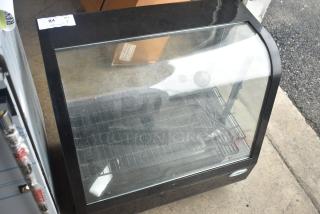 KoolMore CDC-3C-BK countertop display refrigerator, 3.6 Cu Ft, black, with glass front. Appears in used condition.