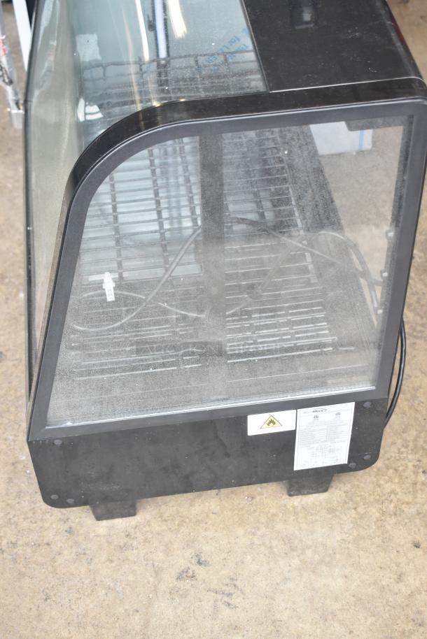 KoolMore CDC-3C-BK countertop refrigerator, 3.6 Cu Ft, black, visible signs of wear, glass front, model and hazard labels displayed.