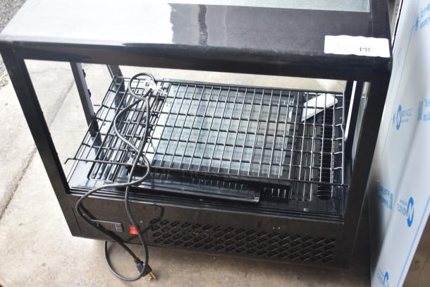 KoolMore CDC-3C-BK countertop display refrigerator, 3.6 cu ft, 110-120 volts, shown unplugged with open shelves.