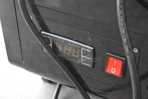 Close-up of KoolMore CDC-3C-BK display refrigerator control panel showing digital display and power switch.