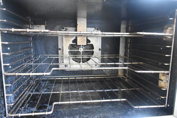 2 Vulcan VC5GD-11D1Z convection ovens with view-through doors, thermostatic controls, commercial casters; interior view.