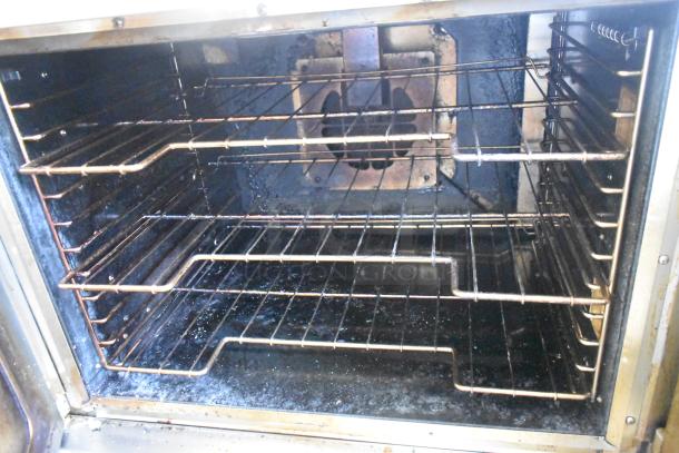 Vulcan VC5GD-11D1Z commercial convection oven interior, with view-through doors, stainless steel racks, and used condition.