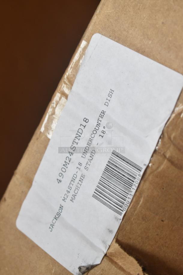 Box with label for Jackson 490M24STND18 undercounter dish machine stand, 20 1/4". New, with visible scratches and dent.
