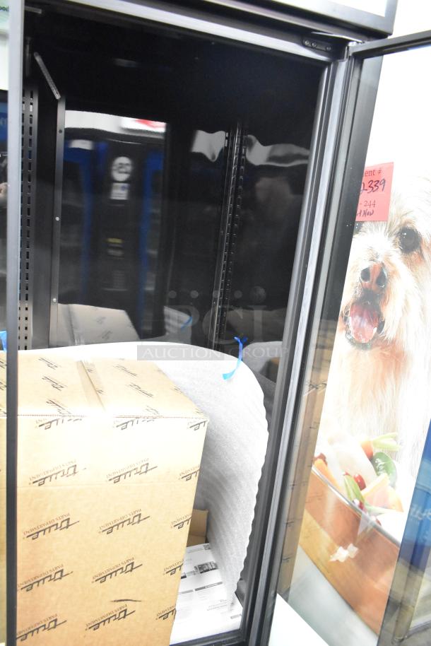 Brand new True TVM-48SL-HC commercial 2-door cooler merchandiser, 2025 model, 115V, visible shipping packaging.