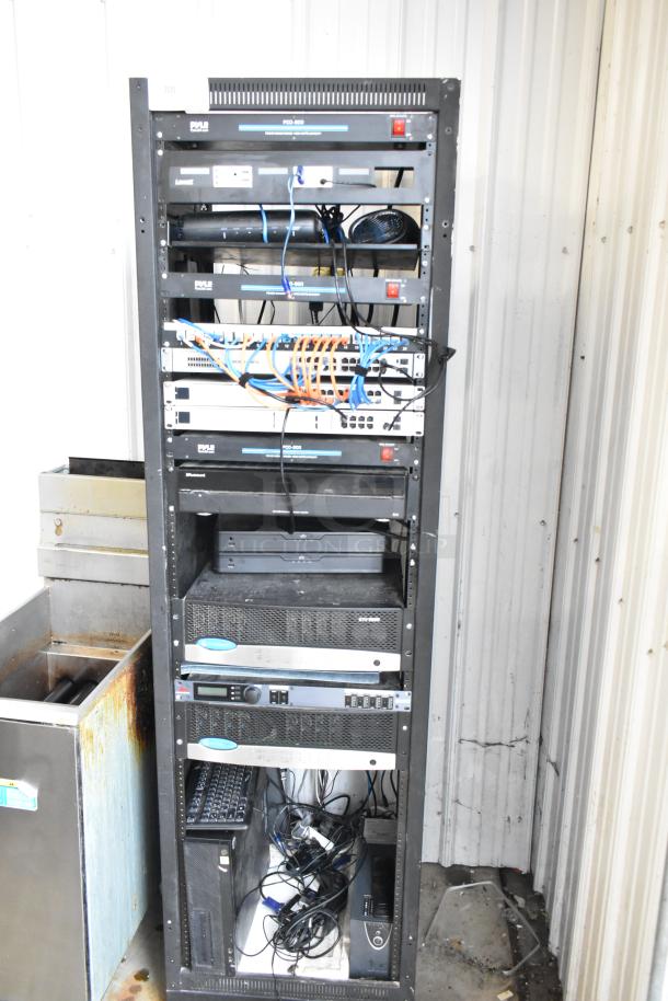 AV cabinet with Pyle PCI-800 and PCO-800 power conditioners, Lowell rack unit, HPE OfficeConnect switch, Russound MCA-88, Crown amplifiers, dbx ZonePRO640, HP computer, and more.