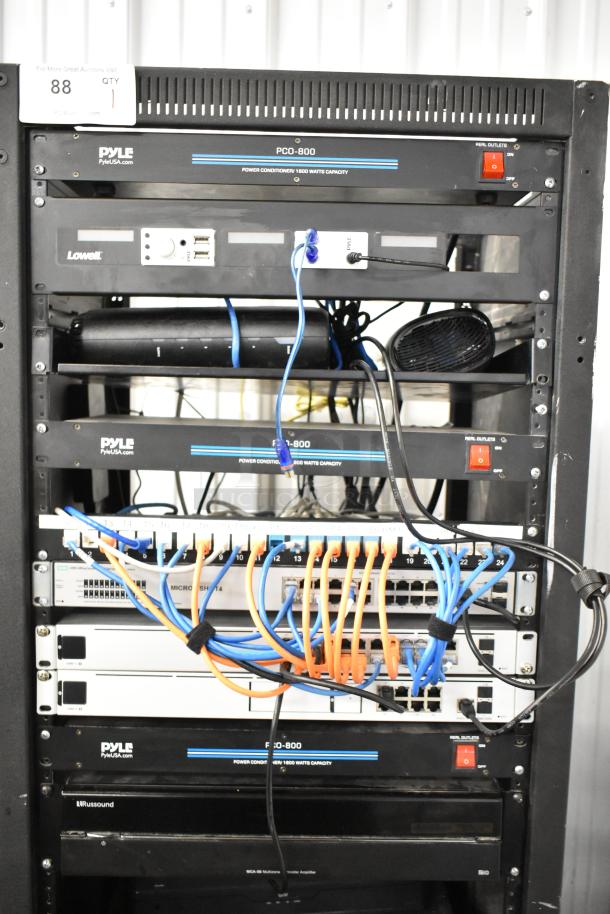 AV Cabinet with Pyle PCI-800 Power Conditioner, Lowell Rack, HPE OfficeConnect Switch, Russound MCA-88, Crown Amplifiers, and more.