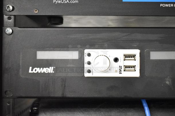 AV cabinet featuring Lowell rack, Pyle PCI-800 power conditioner, visible USB ports, and control panel.