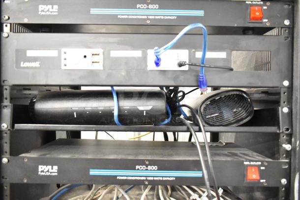 AV cabinet with Pyle PCO-800 power conditioners, Lowell rack unit, blue cables, visible power switch, and additional networking equipment.