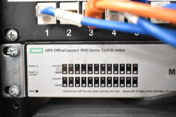 Close-up of HPE OfficeConnect 1820 Series Switch J9980A, ports labeled with link and activity indicators, blue and orange cables connected.
