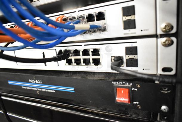 AV Cabinet with Pyle PCO-800 Power Conditioner, network cables, and visible real outlets switch.