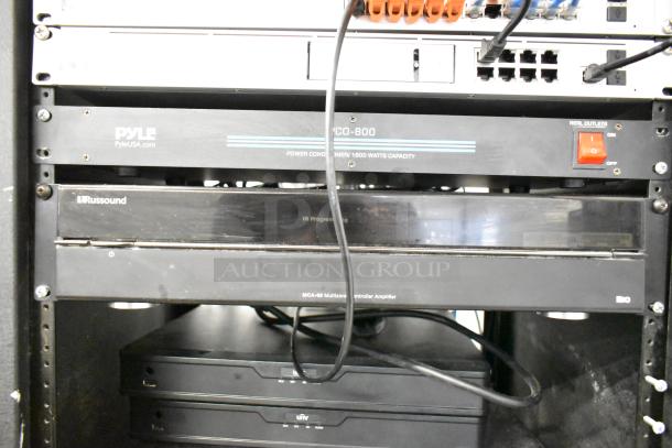 AV cabinet featuring Pyle PCI-800 and PCO-800 power conditioners, Russound MCA-88, and UNV network recorders.
