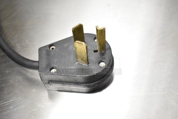 Close-up of a power plug for the Torrie MTE225XC70 commercial espresso machine.
