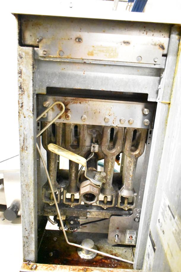 2022 Pitco Frialator 40D natural gas deep fryer with side splash guard and two fry baskets, showing internal gas burners.