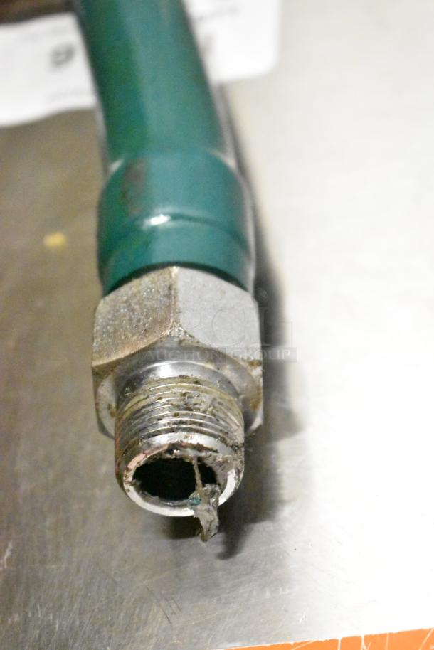 Rusty metal pipe fitting, close-up.