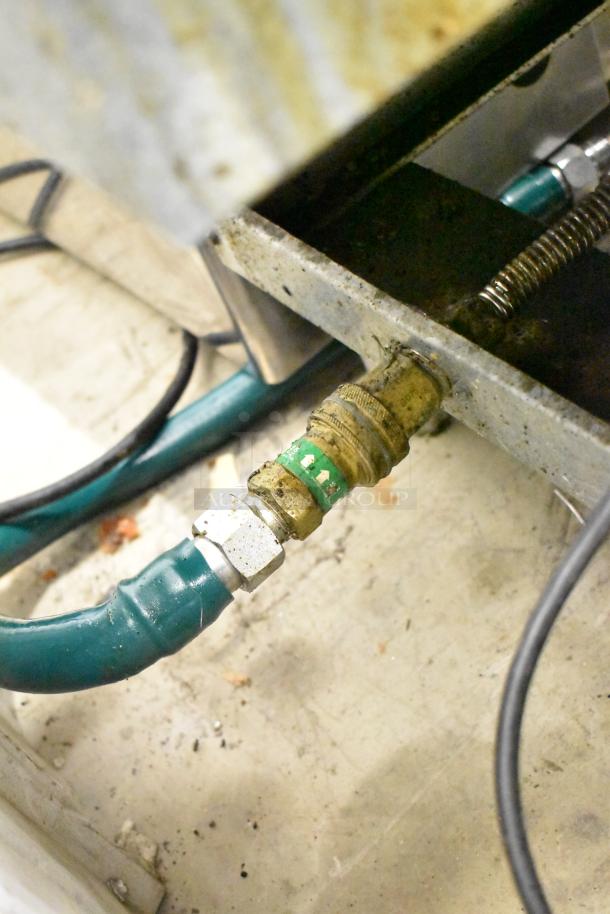 2022 Pitco Frialator 40D gas deep fryer detail, showing hose and connection. Features 107,000 BTU, side splash guard.