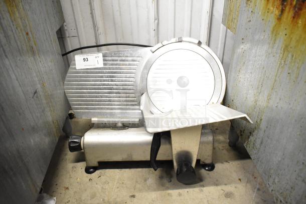 Avantco 177SL312 commercial meat slicer with blade sharpener, 115 volts, 1 phase. Displays wear, features auction tag 93.