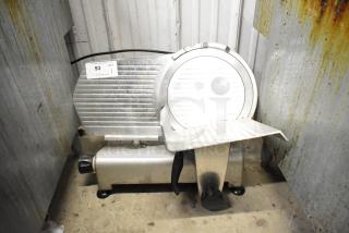 Avantco 177SL312 commercial meat slicer with blade sharpener, 115 volts, 1 phase. Displays wear, features auction tag 93.