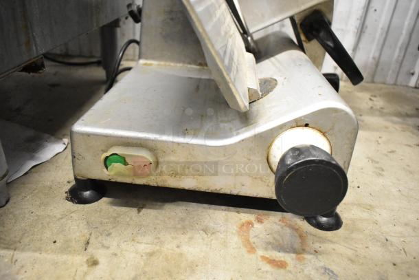 Avantco 177SL312 commercial meat slicer with blade sharpener, 115 volts, used condition, visible wear on surface.