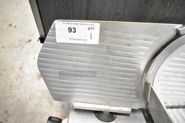Avantco 177SL312 commercial meat slicer, with blade sharpener, 115 volts, 1 phase; moderate wear visible, auction tag present.