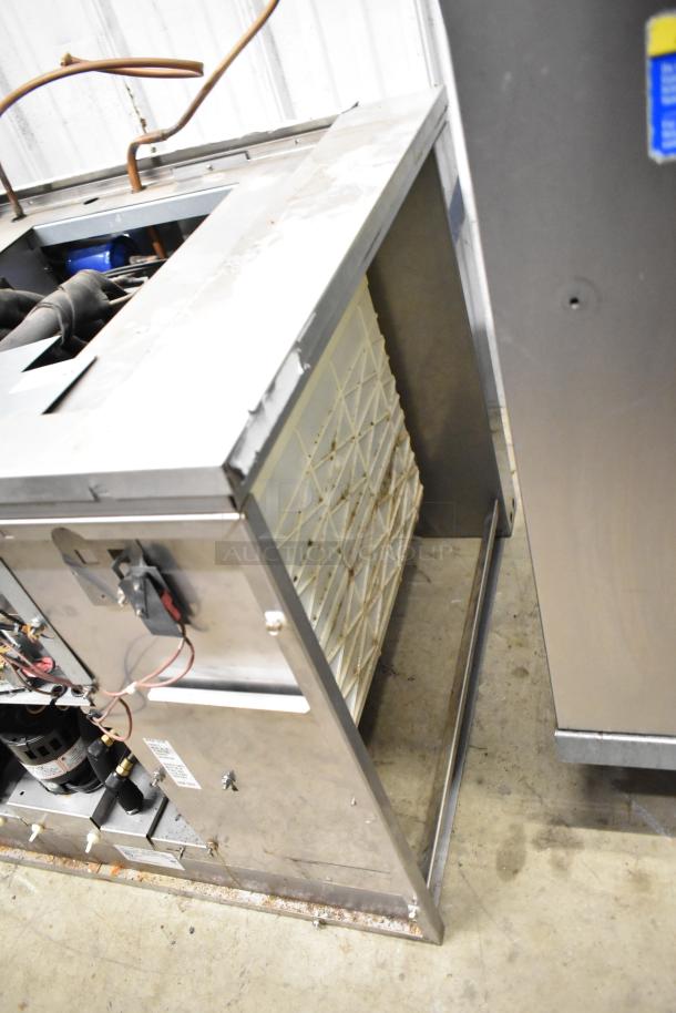 2021 Ice-O-Matic ICE1506HT2 commercial ice head, 208-230 volts, 1 phase. Visible wear, wiring and filter panel shown.