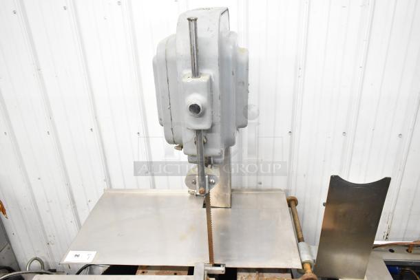 Hobart Commercial Floor Meat Saw in used condition, features a sturdy metal construction with visible saw blade and motor.